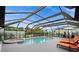 Relaxing screened pool and spa with patio furniture at 10194 Thames Ave, Englewood, FL 34224