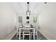 Bright dining room with a large table and chandelier at 10194 Thames Ave, Englewood, FL 34224