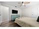 Bedroom with a full-size bed, dresser, and flat-screen TV at 10194 Thames Ave, Englewood, FL 34224
