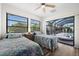 Guest bedroom with two twin beds and sliding glass doors to the pool area at 10194 Thames Ave, Englewood, FL 34224