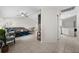 Bright living room with sectional sofa, coffee table, and large windows at 10194 Thames Ave, Englewood, FL 34224