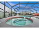 Relaxing pool and spa area with covered patio at 10194 Thames Ave, Englewood, FL 34224