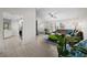 Open concept living room and kitchen with tile floors and vaulted ceilings at 10194 Thames Ave, Englewood, FL 34224