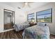 Guest bedroom with twin beds and mirrored closet doors at 10194 Thames Ave, Englewood, FL 34224
