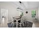 Bright dining room featuring a farmhouse table and chandelier at 10194 Thames Ave, Englewood, FL 34224