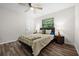 Bedroom with a queen bed, nightstands, and ceiling fan at 10194 Thames Ave, Englewood, FL 34224