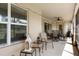 Spacious screened porch featuring comfortable seating and a ceiling fan at 11358 Lomita Wren Rd, Weeki Wachee, FL 34614