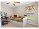 Charming bedroom with daybed, vanity, and window seat at 11358 Lomita Wren Rd, Weeki Wachee, FL 34614