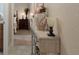 Inviting hallway with decorative console table and view of bedroom at 11358 Lomita Wren Rd, Weeki Wachee, FL 34614