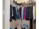 Walk-in closet with clothing and accessories neatly organized at 11358 Lomita Wren Rd, Weeki Wachee, FL 34614
