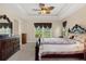 Main bedroom with a king-size bed, large windows and plenty of natural light at 11358 Lomita Wren Rd, Weeki Wachee, FL 34614