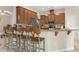 Modern kitchen with stainless steel appliances and breakfast bar at 11358 Lomita Wren Rd, Weeki Wachee, FL 34614