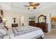 Main bedroom with king-size bed, dresser, and views of backyard at 11358 Lomita Wren Rd, Weeki Wachee, FL 34614