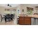 Cozy dining area with table and chairs near kitchen at 11358 Lomita Wren Rd, Weeki Wachee, FL 34614