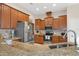 Well-equipped kitchen featuring granite countertops and ample cabinetry at 11358 Lomita Wren Rd, Weeki Wachee, FL 34614