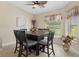 Bright dining area with table and chairs, large windows, and decorative accents at 11358 Lomita Wren Rd, Weeki Wachee, FL 34614