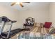 Bright bedroom with treadmill, daybed, and vanity at 11358 Lomita Wren Rd, Weeki Wachee, FL 34614