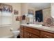 Clean bathroom with vanity, shower, and decorative accents at 11358 Lomita Wren Rd, Weeki Wachee, FL 34614