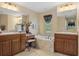 Double vanity bathroom with soaking tub and separate shower at 11358 Lomita Wren Rd, Weeki Wachee, FL 34614