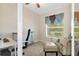 Bright home office features built-in shelving and window seat at 11358 Lomita Wren Rd, Weeki Wachee, FL 34614