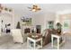Open living room with comfortable seating and a view into the bedroom at 11358 Lomita Wren Rd, Weeki Wachee, FL 34614