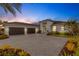 Stunning curb appeal with a three-car garage at 9004 Artisan Way, Sarasota, FL 34240
