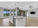 Modern kitchen with large island and stainless steel appliances at 9004 Artisan Way, Sarasota, FL 34240