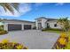 Luxury home with three-car garage and landscaped yard at 9004 Artisan Way, Sarasota, FL 34240