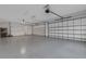Spacious two-car garage with epoxy flooring at 9004 Artisan Way, Sarasota, FL 34240