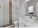 Modern bathroom with glass shower, vanity, and decorative tile at 9004 Artisan Way, Sarasota, FL 34240