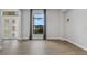 Bright living room with hardwood floors and large windows at 9004 Artisan Way, Sarasota, FL 34240