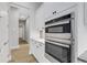 Modern kitchen with double oven and granite countertops at 9004 Artisan Way, Sarasota, FL 34240