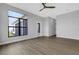 Spacious Gathering room featuring large windows and wood-look flooring at 9004 Artisan Way, Sarasota, FL 34240