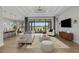 Spacious living room with lake view and modern decor at 9004 Artisan Way, Sarasota, FL 34240