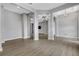 Spacious dining room with hardwood floors and a modern chandelier at 9004 Artisan Way, Sarasota, FL 34240