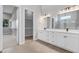 Elegant bathroom with double vanity, large walk-in shower, and walk-in closet at 9004 Artisan Way, Sarasota, FL 34240