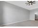 Main bedroom with ceiling fan and access to a bathroom at 9004 Artisan Way, Sarasota, FL 34240
