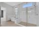 Modern bathroom featuring a freestanding tub and a glass-enclosed shower at 9004 Artisan Way, Sarasota, FL 34240