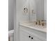 Modern bathroom with white vanity, quartz countertop, and gold fixtures at 9004 Artisan Way, Sarasota, FL 34240