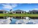 Home's backyard features a lake view at 9004 Artisan Way, Sarasota, FL 34240