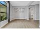 Bright dining room with hardwood floors and modern chandelier at 9004 Artisan Way, Sarasota, FL 34240