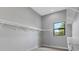 Spacious walk-in closet with ample shelving and natural light at 9004 Artisan Way, Sarasota, FL 34240