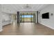 Open concept living room with lake view and hardwood floors at 9004 Artisan Way, Sarasota, FL 34240
