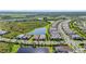 Breathtaking aerial shot capturing the community layout with multiple ponds and stunning green spaces at 14480 Eagle Branch Dr, Nokomis, FL 34275
