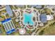 Overhead view of a resort-style pool area with ample seating and lush landscaping at 14480 Eagle Branch Dr, Nokomis, FL 34275