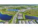 Stunning aerial view showcasing a scenic community with lush green spaces and tranquil ponds at 14480 Eagle Branch Dr, Nokomis, FL 34275
