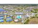 Aerial view showcasing community amenities: pool, tennis, bocce ball and recreation areas at 14480 Eagle Branch Dr, Nokomis, FL 34275