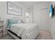 Cozy bedroom featuring a bed with a floral pattern comforter and closet space at 14480 Eagle Branch Dr, Nokomis, FL 34275