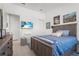 Bedroom featuring neutral tones, a mounted TV, and closet space at 14480 Eagle Branch Dr, Nokomis, FL 34275