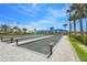 Well-kept bocce ball courts with shaded seating areas at Talon Preserve on Palmer Ranch at 14480 Eagle Branch Dr, Nokomis, FL 34275